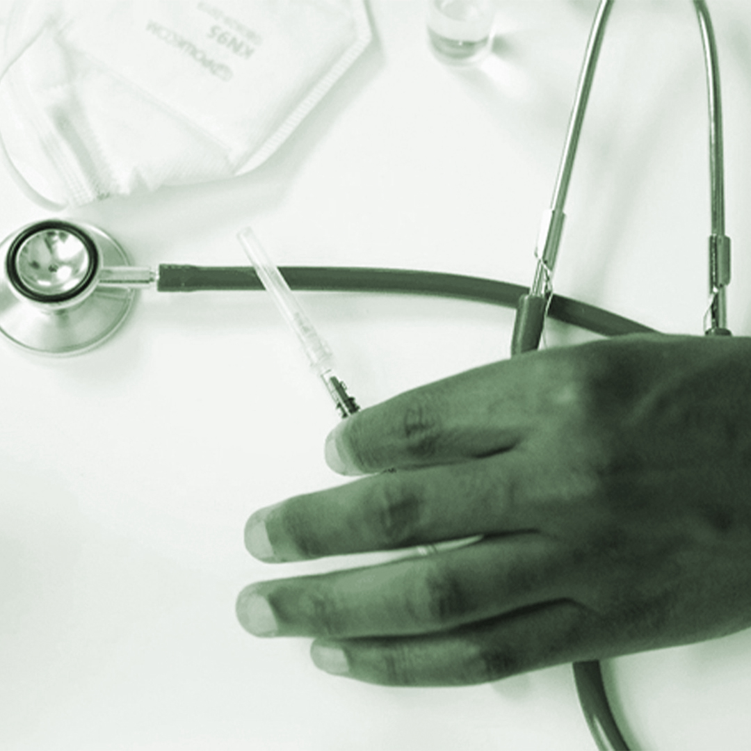 Doctor holding needle, representing IVF injection procedure